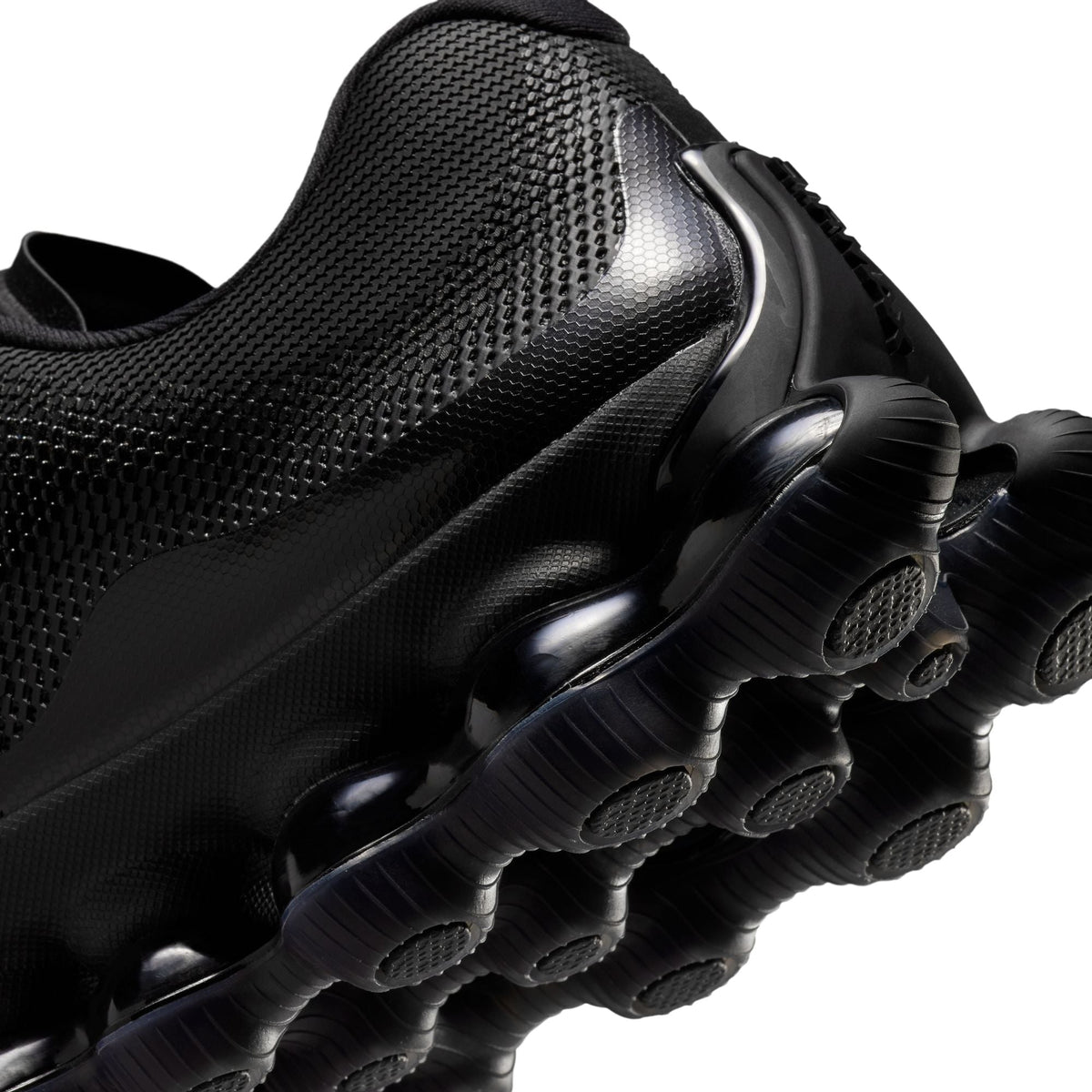 Black Nike Men's Air Liquid Max sneakers, side view