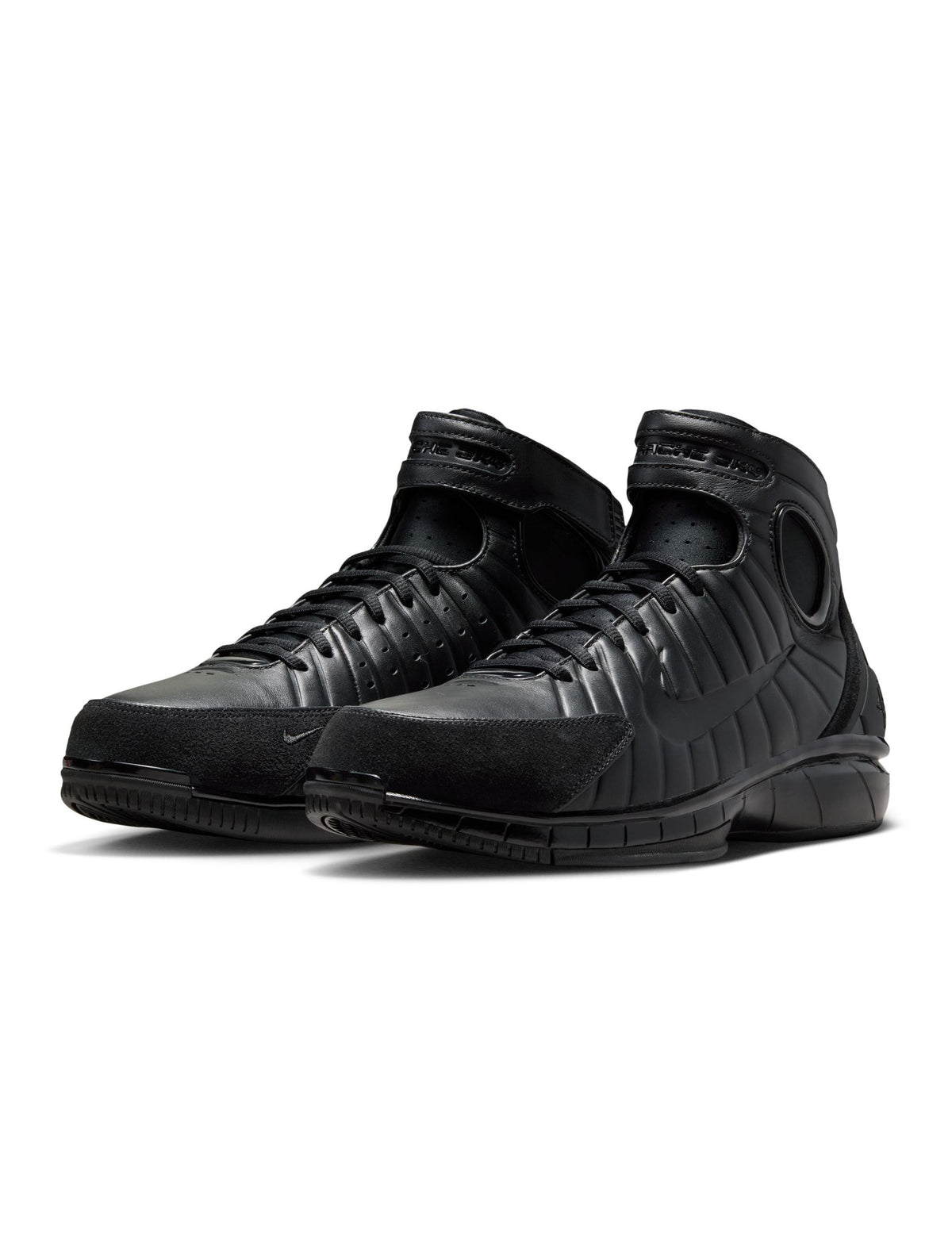 Black Nike Men's Air Zoom Huarache 2K4 OT basketball shoes with Nike logo and sporty design.
