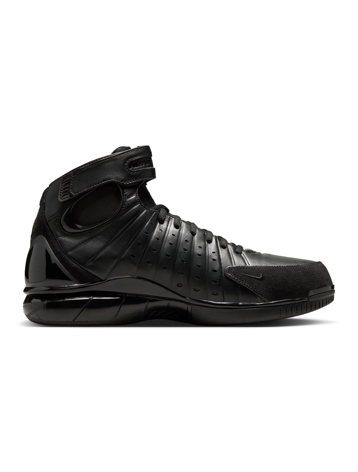 Black Nike Air Zoom Huarache 2K4 OT men's footwear shown on a model, featuring sleek design and athletic style.