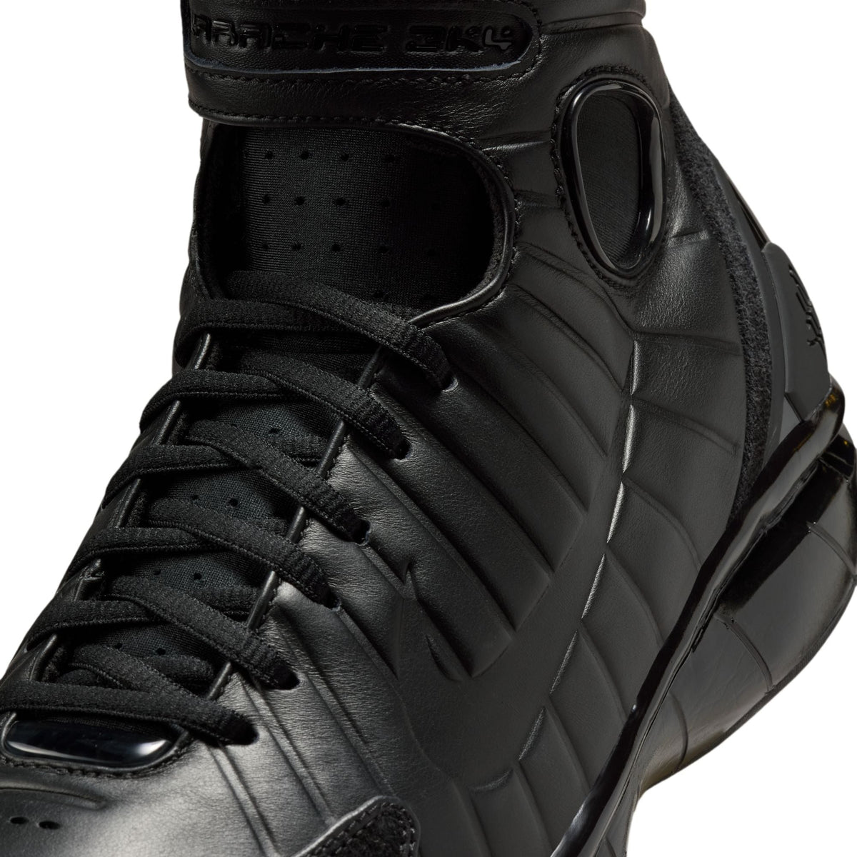 Nike men's Air Zoom Huarache 2K4 OT basketball shoes in black with a sleek design and sporty appearance.