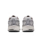 Nike Mens Air Max Moto 2K platinum tint athletic footwear with sleek design and breathable fabric, perfect for casual wear and sports.