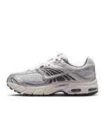 Nike men's Air Max Moto 2K sneakers in platinum tint, showcasing sleek design and breathable mesh upper.
