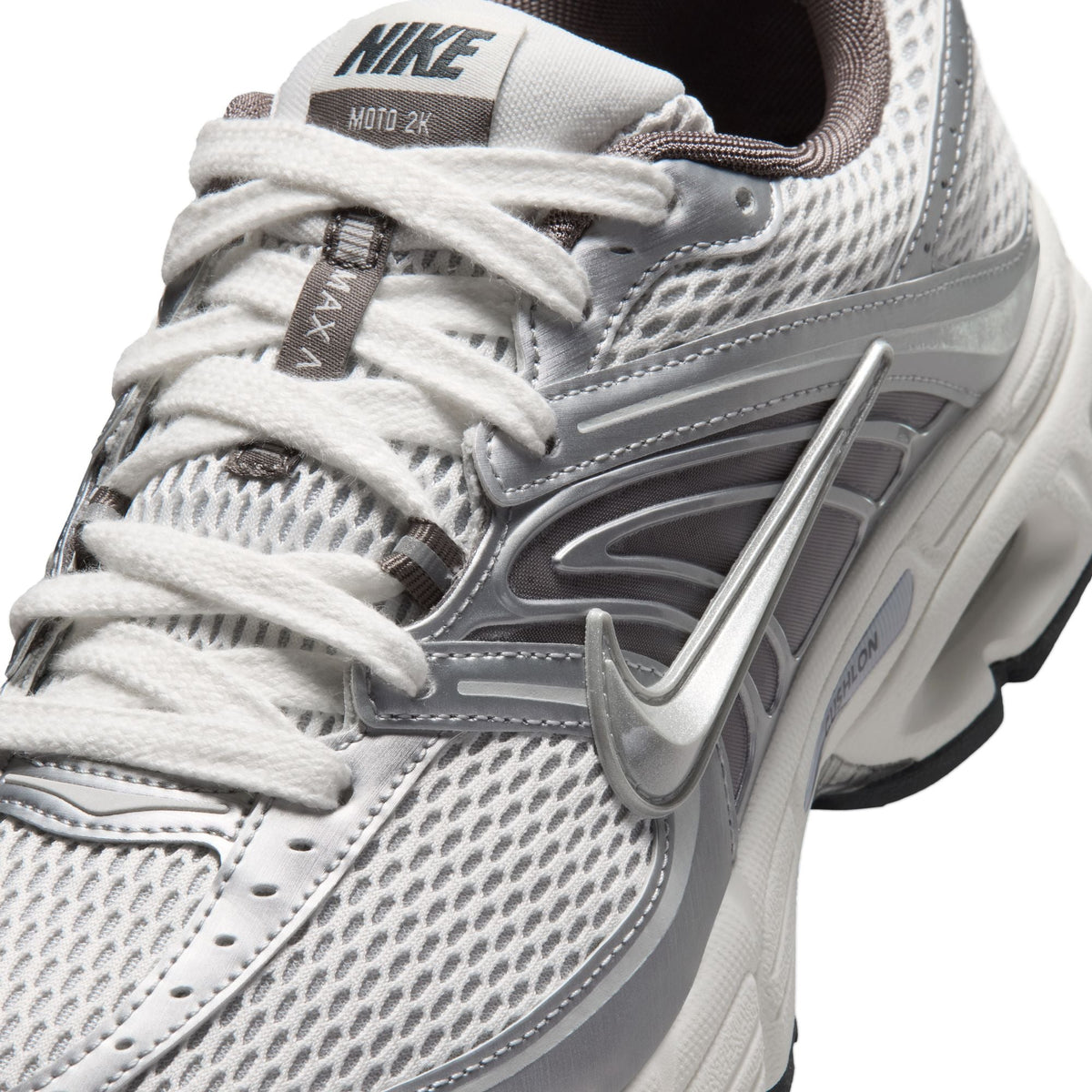 Nike Mens Air Max Moto 2K sneakers in platinum tint, featuring sleek design and visible Air Max cushioning for comfort.