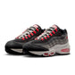 Nike Men’s Air Max 95 Big Bubble Solar Red sneakers, showcasing vibrant red and textured design on athletic footwear.