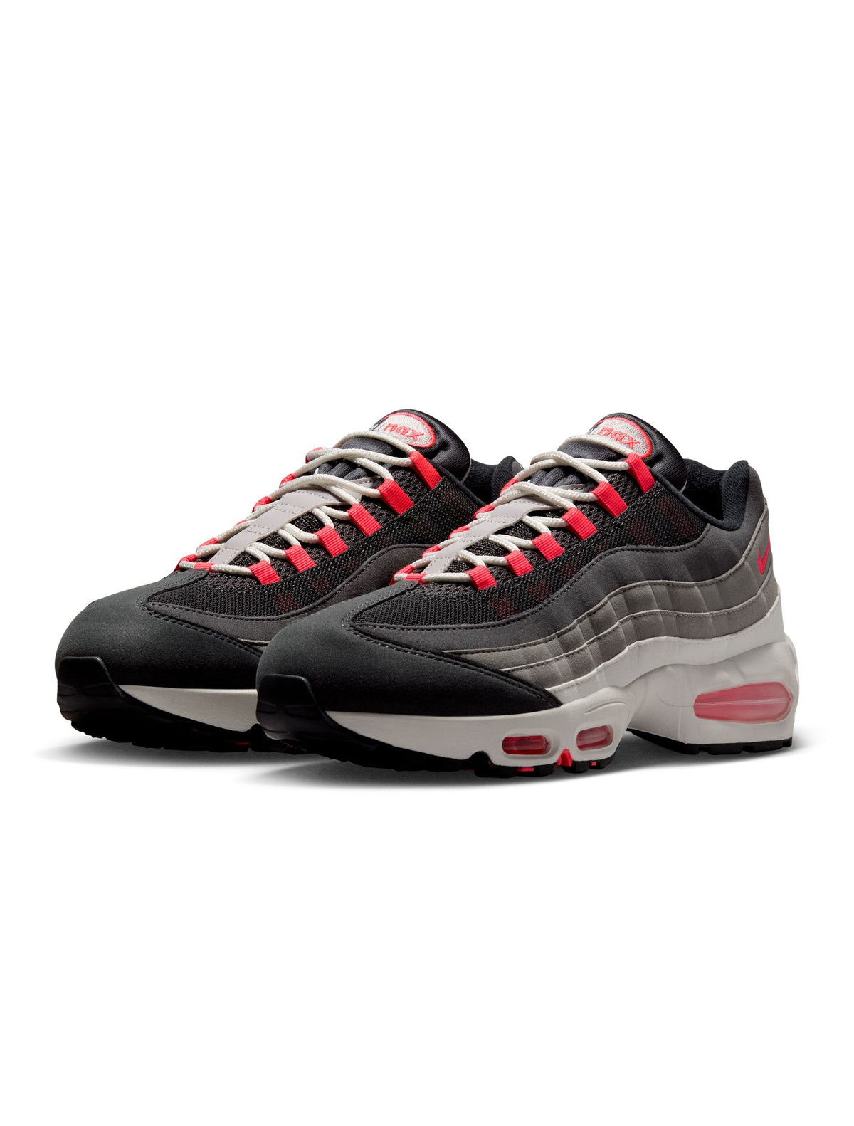 Nike Men’s Air Max 95 Big Bubble Solar Red sneakers, showcasing vibrant red and textured design on athletic footwear.