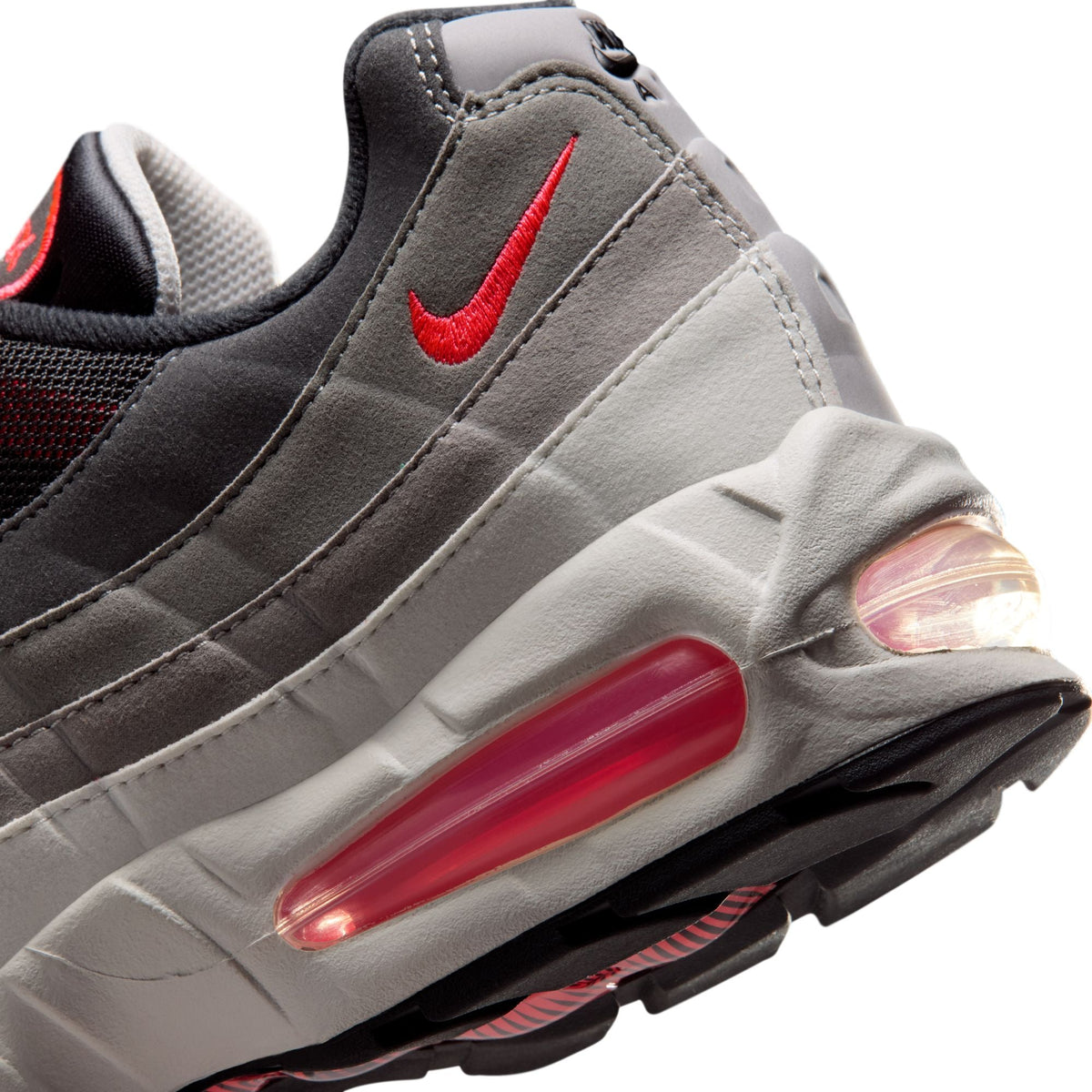 Nike Mens Air Max 95 Big Bubble Premium solar red sneakers, side view showcasing the vibrant color and classic design.