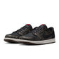 Men's Air Jordan 1 Low OG Laser sneakers in black and white with a sleek design, displayed on a plain background.
