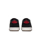 Gradeschool Air Jordan 1 Retro Low OG Laser sneakers in black and red, featuring sleek leather design and iconic Jordan branding.