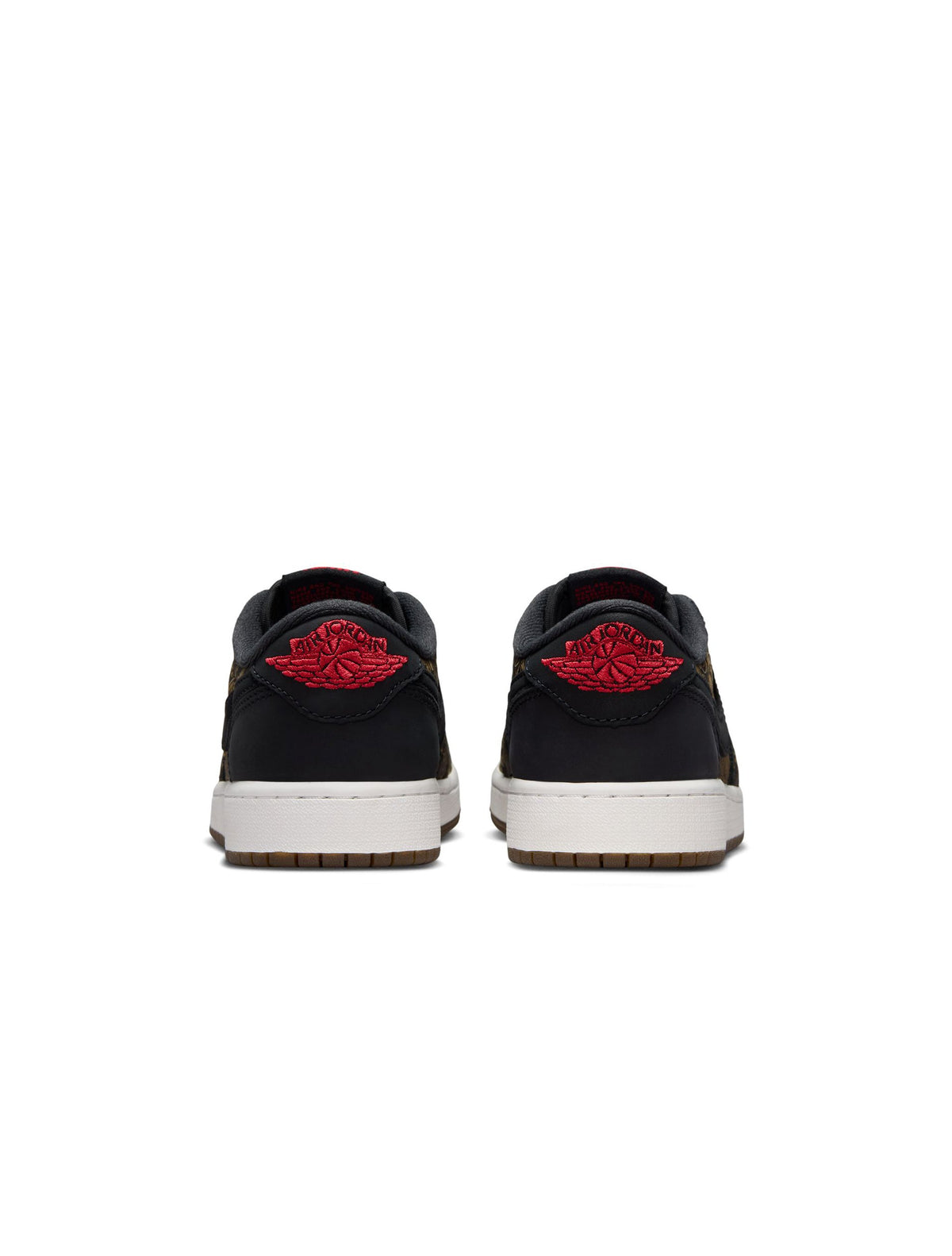 Gradeschool Air Jordan 1 Retro Low OG Laser sneakers in black and red, featuring sleek leather design and iconic Jordan branding.