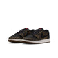 Gradeschool Air Jordan Big Kids 1 Retro Low OG Laser sneakers in black and red with Nike swoosh and low-top design.