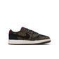Laser Air Jordan 1 Retro Low OG gradeschool sneakers in black and red with Nike swoosh on a clean white background.