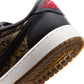 Gradeschool Air Jordan 1 Retro Low OG Laser sneakers in black and red with a sleek design, displayed on a white background.