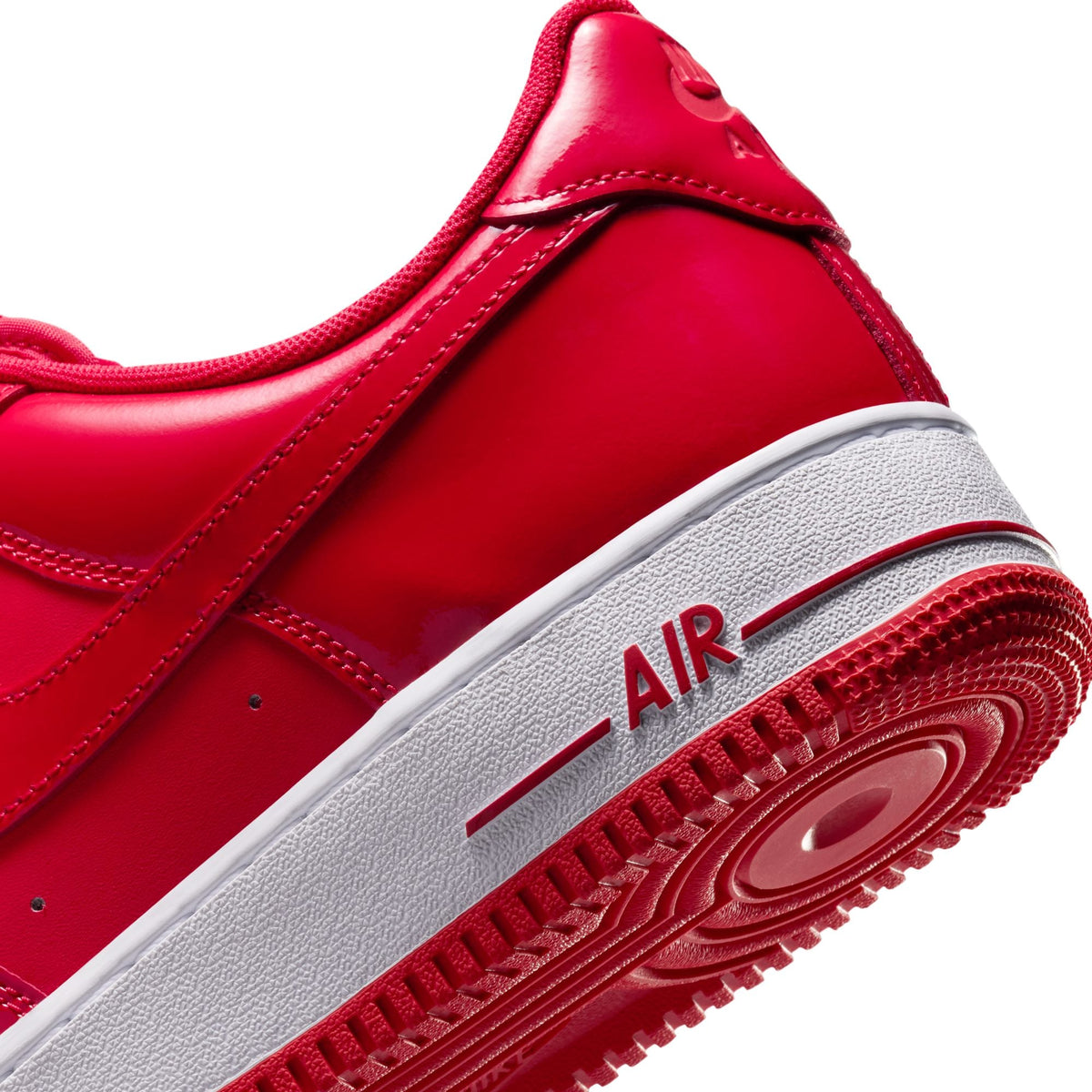 Nike Mens Air Force 1 '07 LV8 Patent sneakers in University Red, featuring shiny patent leather and classic design.