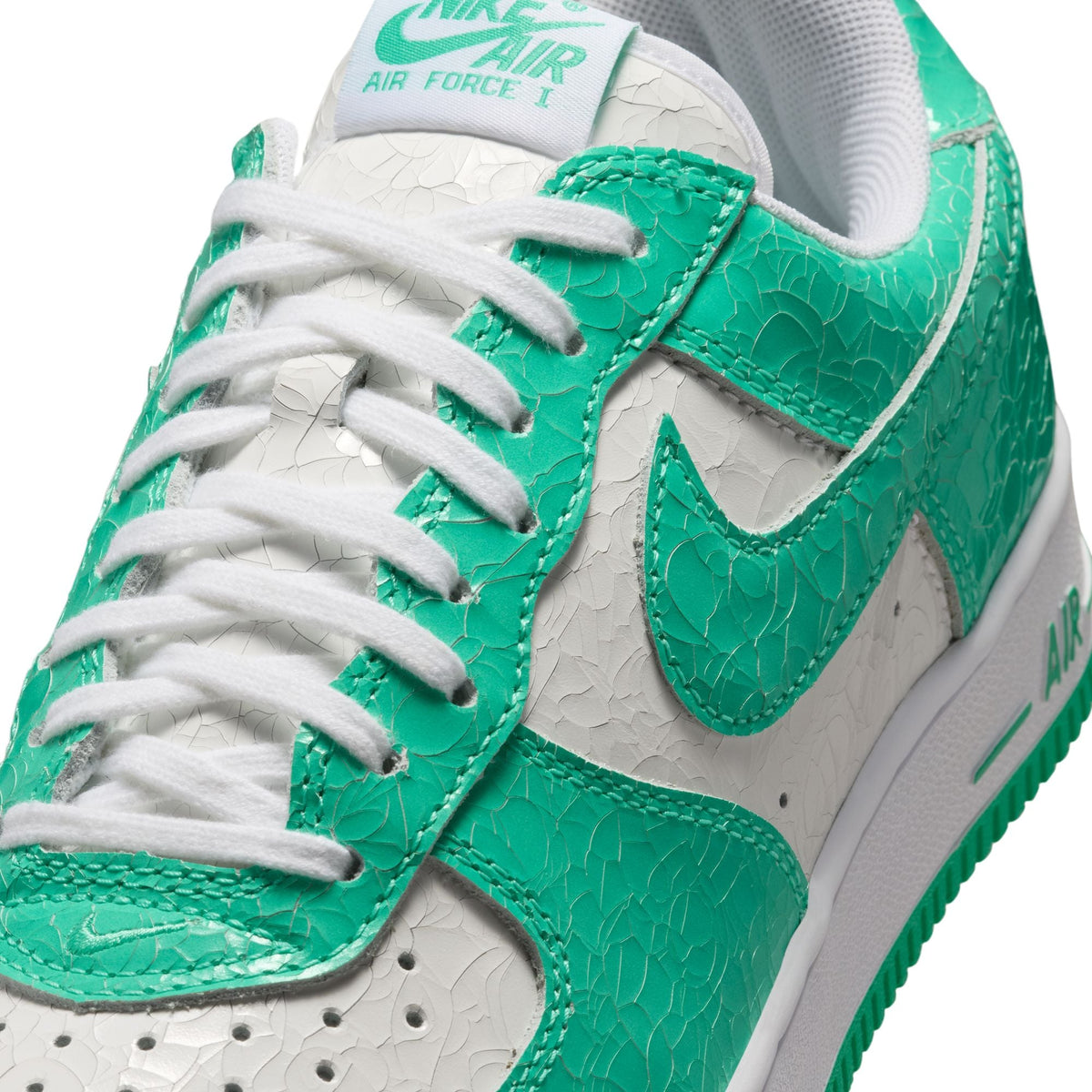 Nike Mens Air Force 1 Menta sneakers in white and green, showcasing the classic design and stylish details of the footwear.