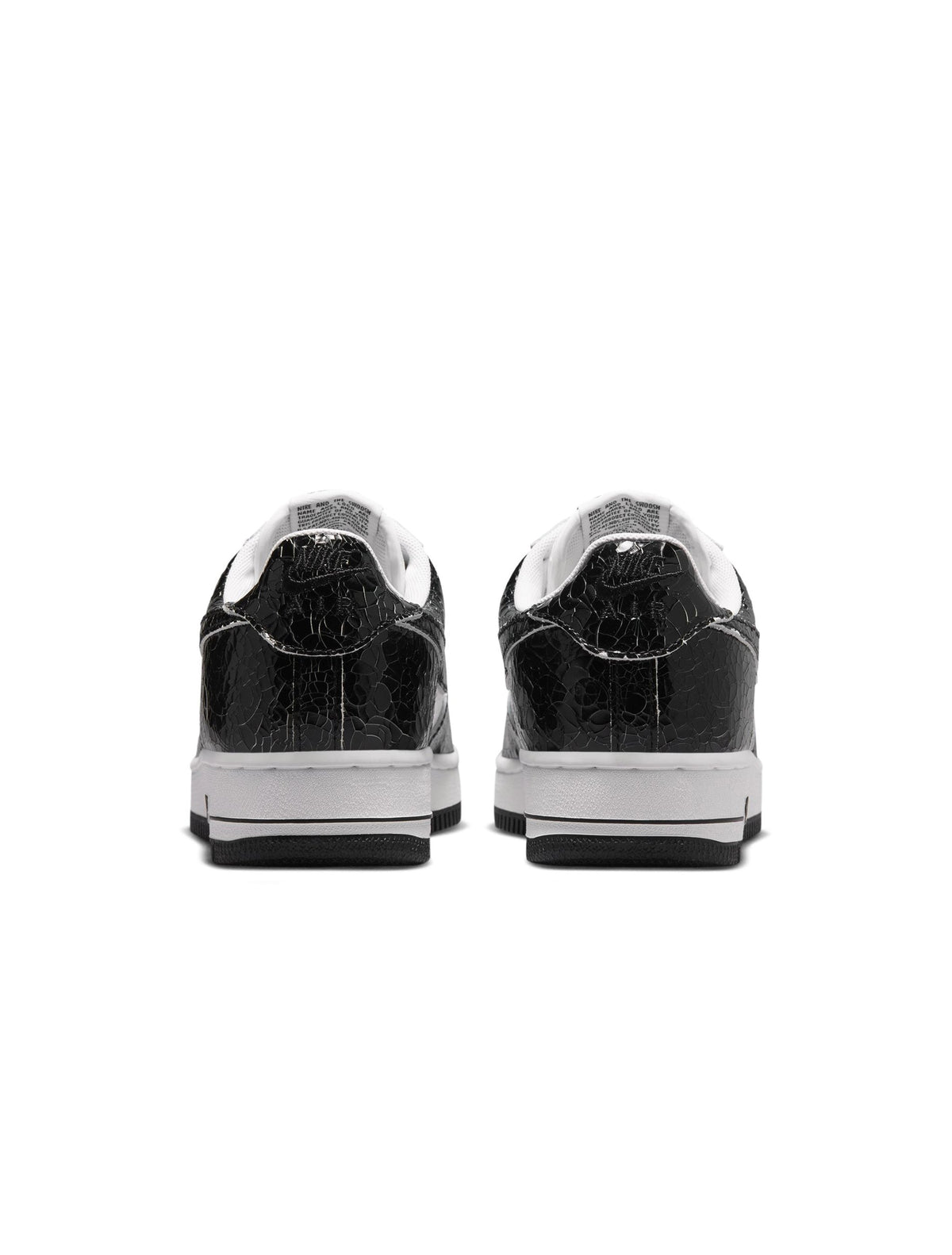 Nike men's Air Force 1 cracked leather sneakers in a detailed side view