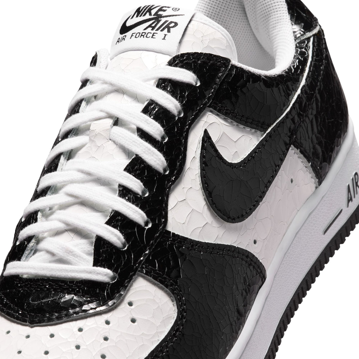 Nike men's Air Force 1 cracked leather sneakers in white with textured leather upper.
