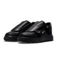 Black Nike Air Force 1 Luxe men's footwear with sleek design and premium materials, displayed on a clean background.
