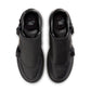 Black Nike Air Force 1 Luxe men's footwear with white soles and sleek design, showcased in a well-lit retail display.