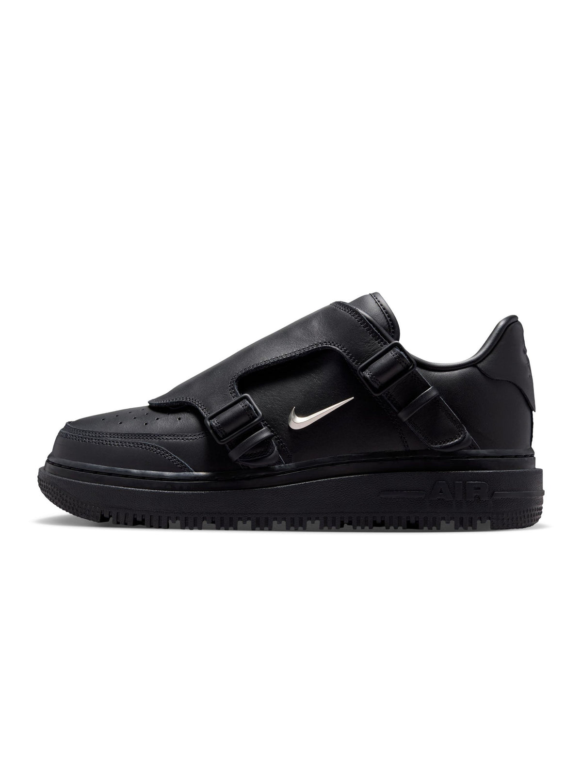 Nike Men's Air Force 1 Luxe black sneakers, stylish footwear with premium design, shown in a close-up shot on a white background.