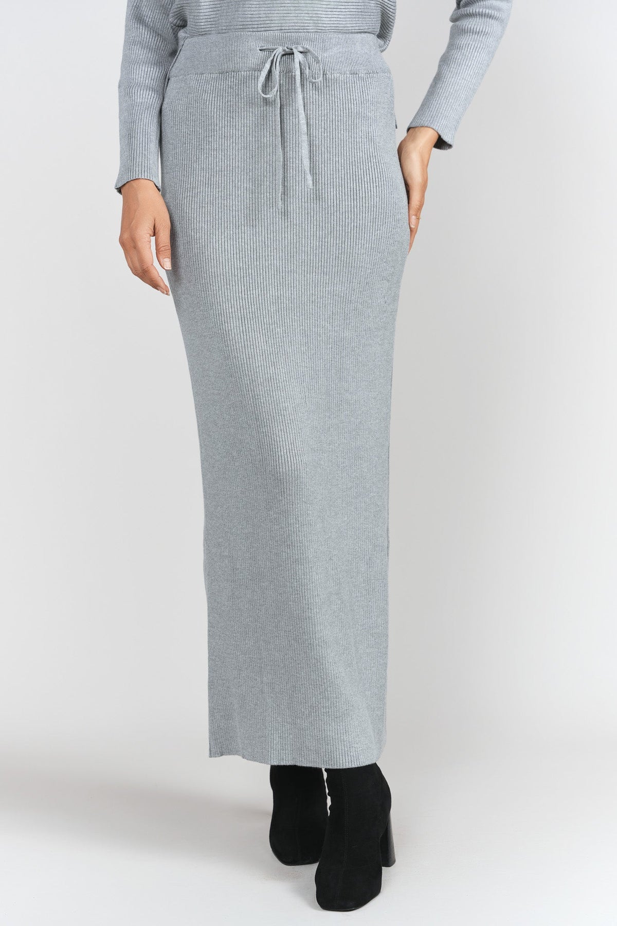 Gray rib-knit skirt by Adina Las Vegas featuring a fitted silhouette and stylish design.