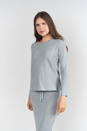 Gray ribbed sweater top by Adina Las Vegas featuring a fitted design and long sleeves, perfect for casual wear.