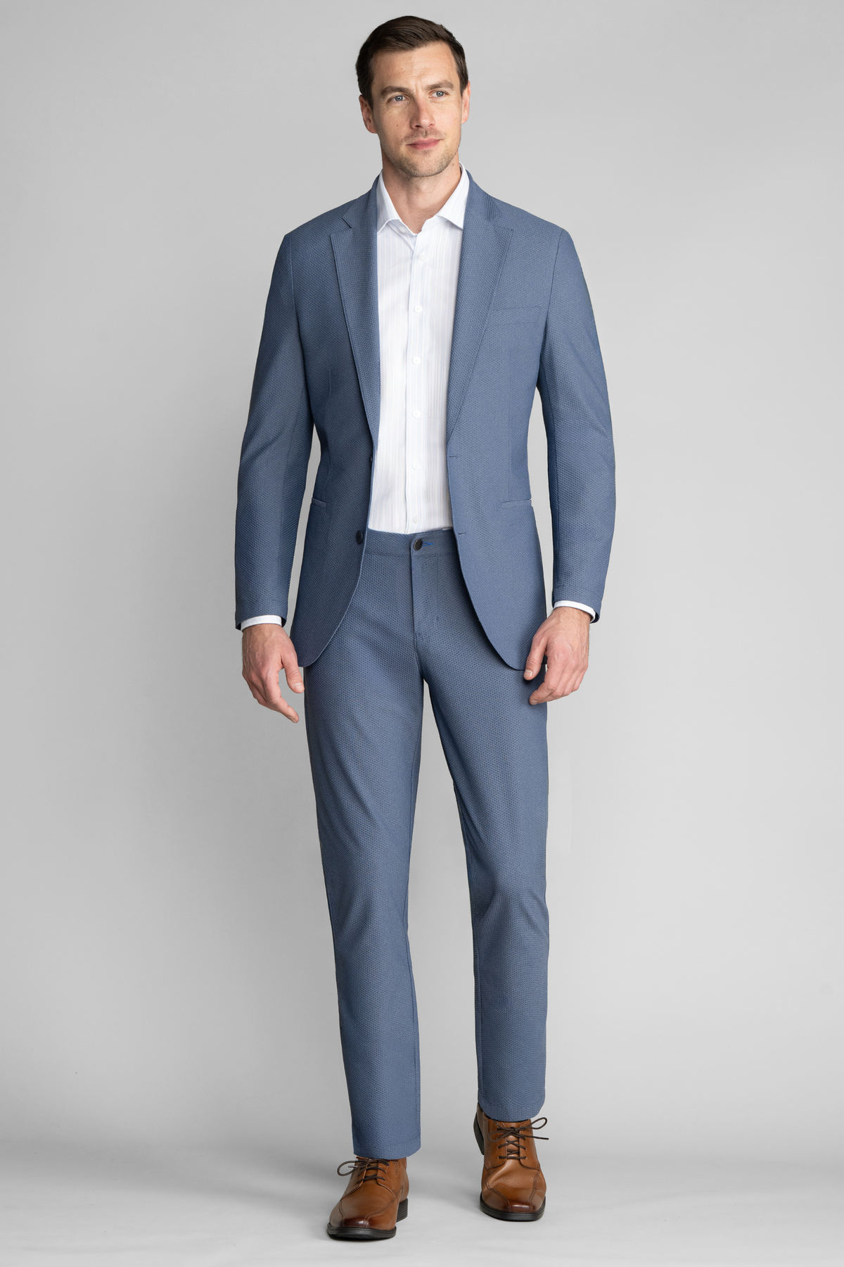 Twillory AIR Pants in denim melange with a relaxed fit, shown in a full-body view on a model.
