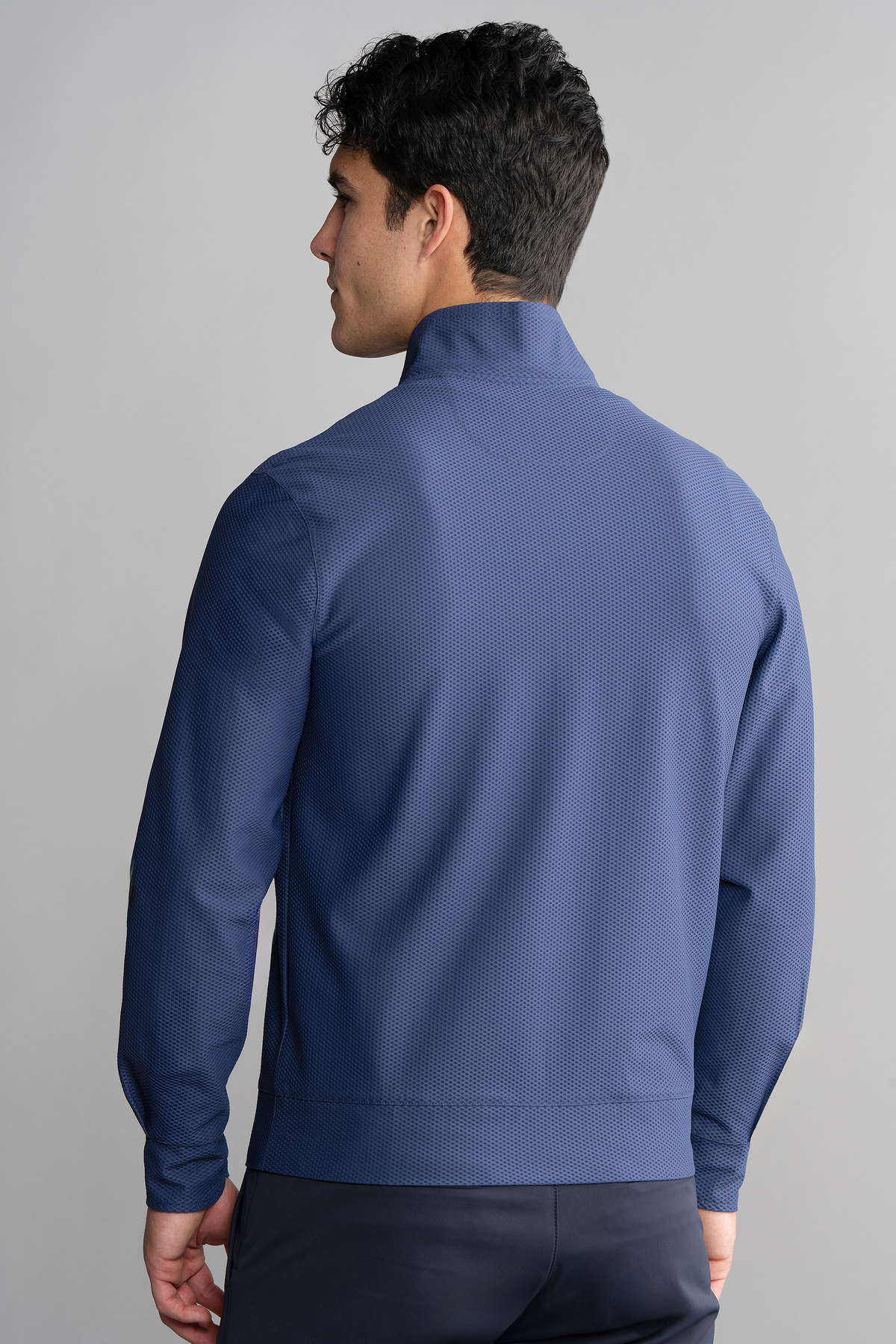 Blue Twillory Air Quarter Zip shirt displayed from the back, showing the fitted design and fabric texture.