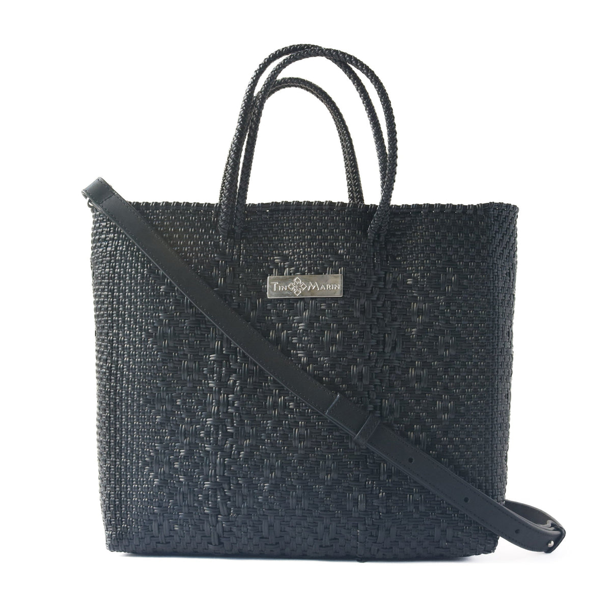 All black large woven crossbody bag by Tin Marin Brand with adjustable strap and textured woven design.