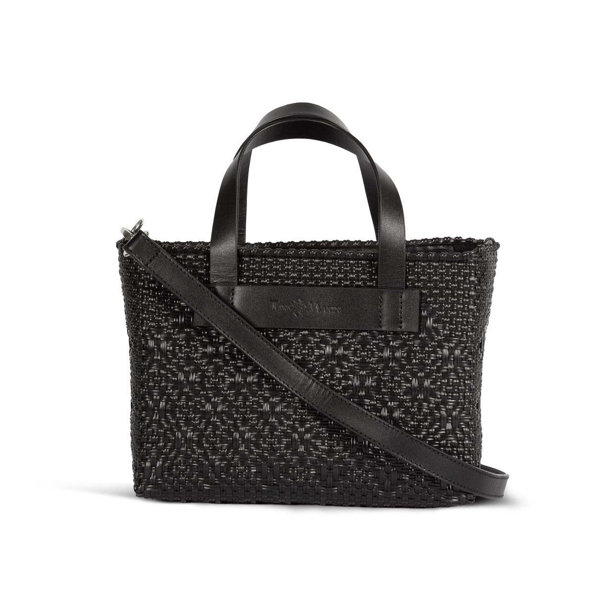 All black small woven crossbody bag by Tin Marin Brand, featuring a compact design with a woven texture and adjustable strap.