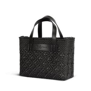 All black small woven crossbody bag by Tin Marin Brand with adjustable strap and compact design.