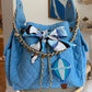 BEACH HAUS Bayshore Bucket Medium in sky blue, structured bucket-style bag with top handles