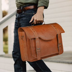 Leather messenger bag from Classy Leather Bags, featuring a classic design with sturdy handles and a smooth finish.
