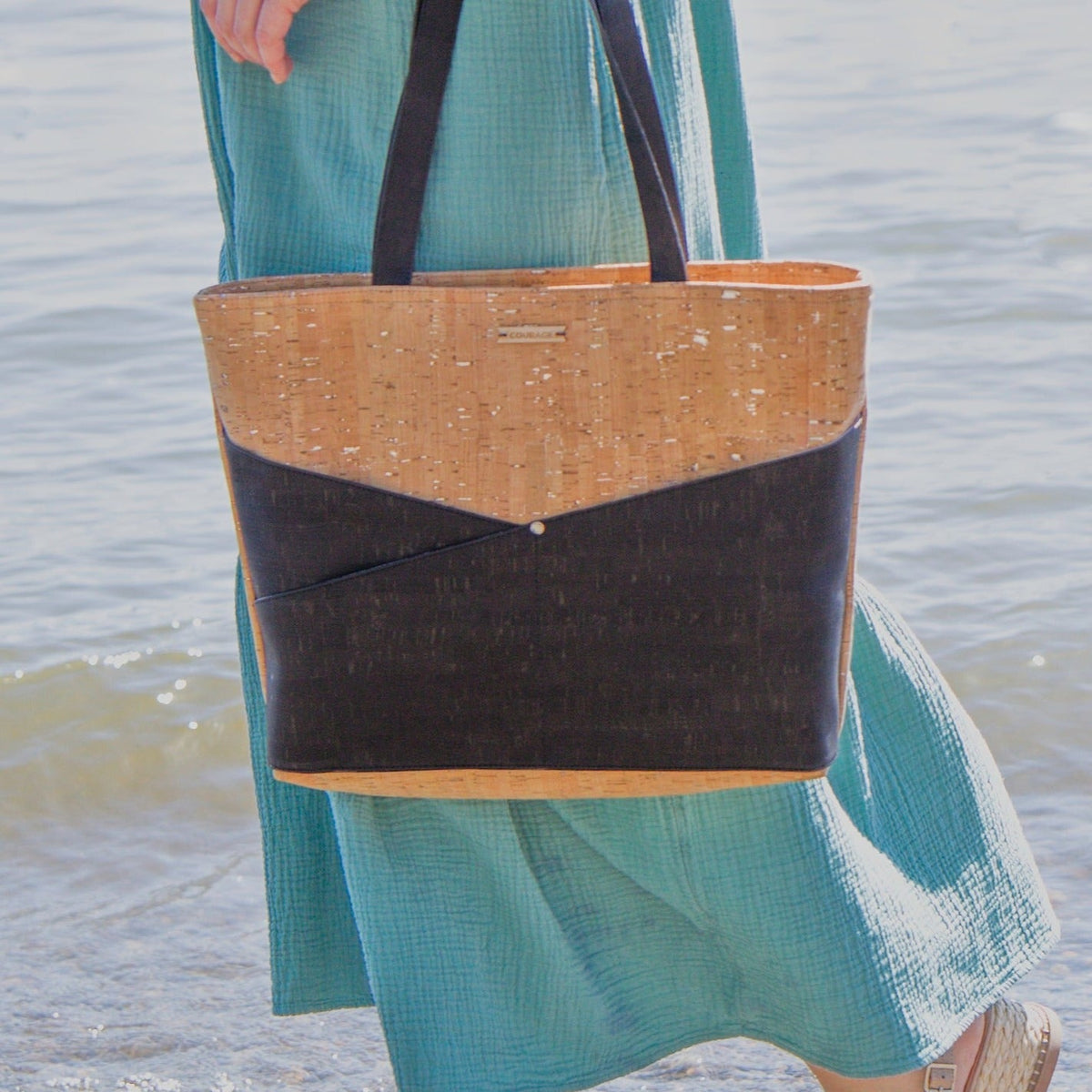 Carry Courage ADVOCATE zippered tote in coal gray, showing structured design and top zip closure