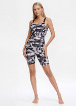 Grey camo romper by Trophy Yoga, made in USA; sleeveless one-piece jumpsuit with a relaxed fit