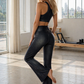 Trophy Yoga vintage denim flare leggings, made in USA, shown in a relaxed fit-reaching pose
