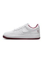 Nike men's Kobe Air Force 1 Low sneakers in white with team red accents, showcasing the stylish low-top design and branding.
