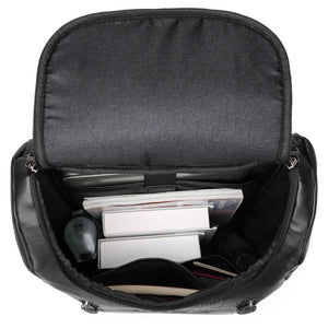 Travellty Roamer 22L vegan leather backpack in black, showing the interior with multiple compartments and a sleek design.