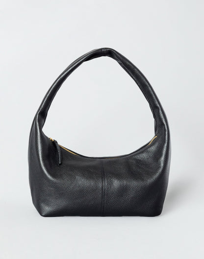 Black and gold leather shoulder bag by HYER GOODS featuring a sleek design and adjustable strap for everyday use.