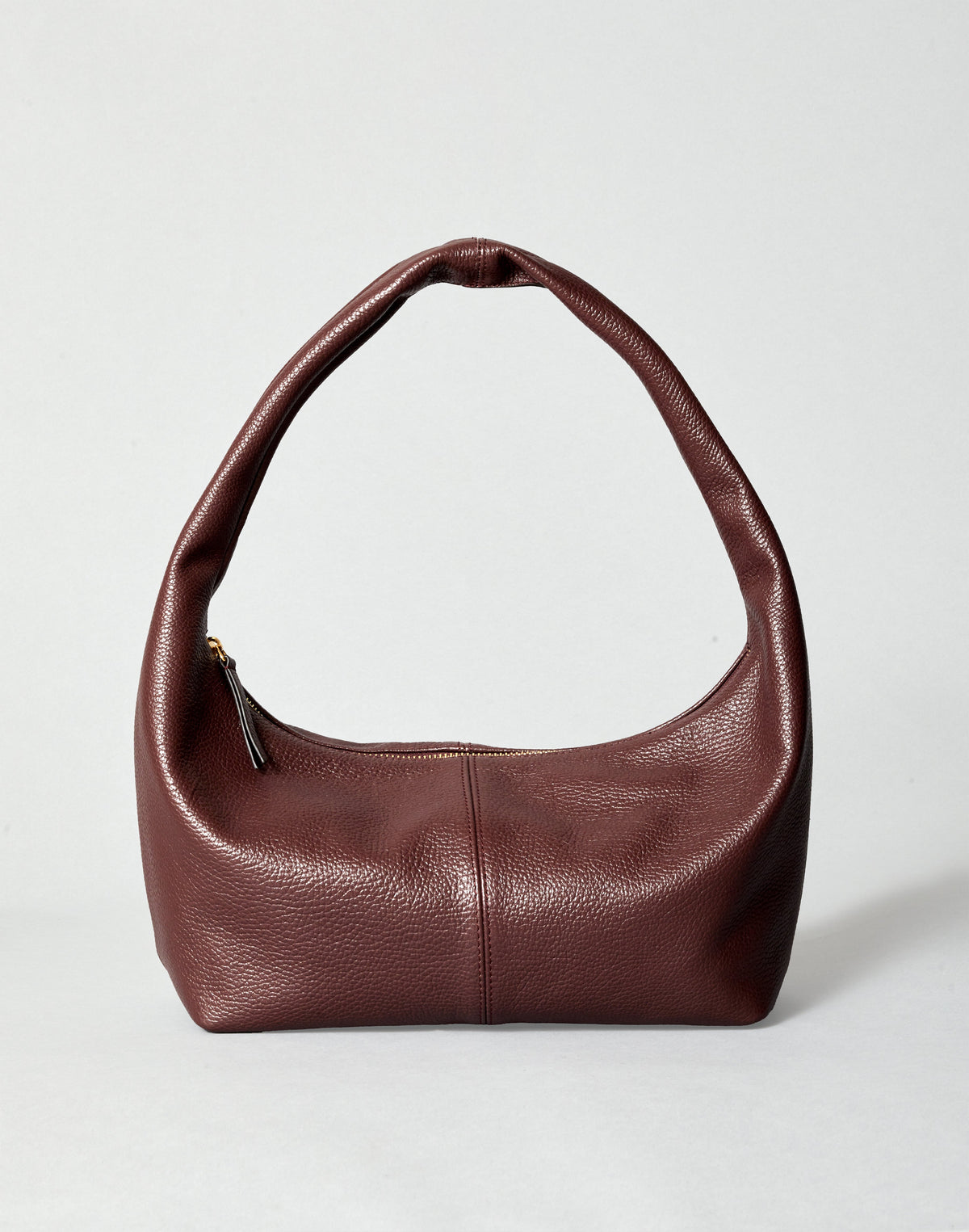 HYER GOODS Everyday Shoulder Bag in burgundy gold with a sleek strap and minimalist design, placed on a neutral background.