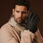 Black Emilio leather winter gloves with deerskin exterior, cashmere lining, and adjustable snap button for a luxurious fit.