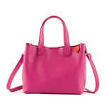 Hot pink Emma leather small crossbody bag by Tin Marin Brand, showing its compact design and stylish strap.