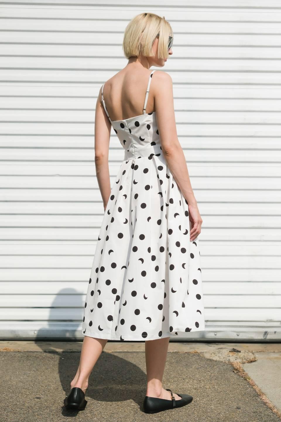 White Flying Tomato Harmony Horizon woven midi dress displayed on a hanger with a flowing, textured fabric design.