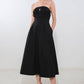 Black Mystic Muse woven midi dress by Flying Tomato, featuring a flowing silhouette and intricate woven fabric.