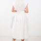 Off-white woven midi dress by Flying Tomato featuring a deep connection design, with flowing fabric and stylish silhouette.