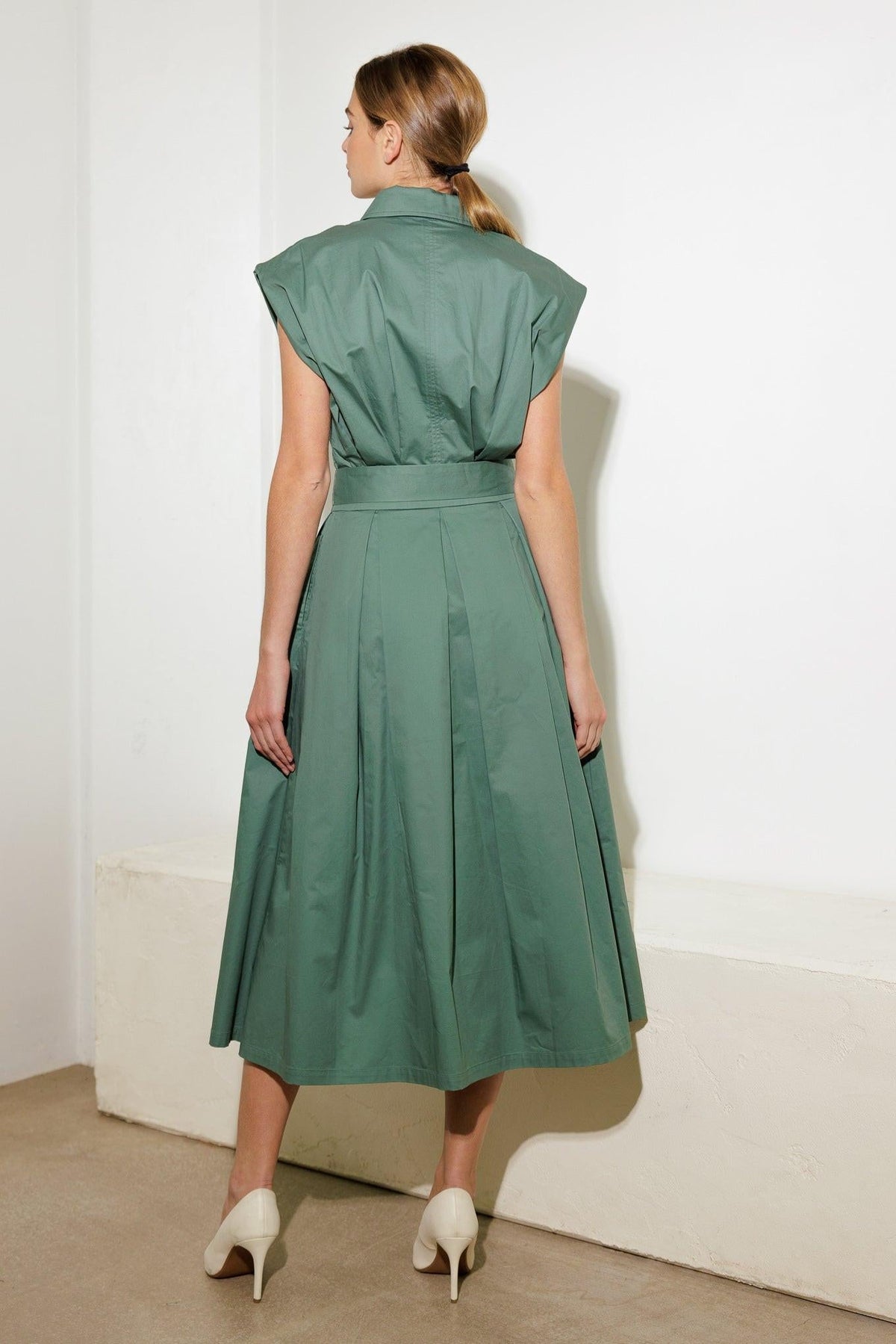 Flying Tomato Deeper Connection Woven Midi Dress in sage green, showing its flowing fabric and stylish design.