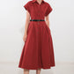 Flying Tomato Perfect Balance Woven Midi Dress in berry color, featuring a stylish, comfortable dress with a fitted waist and flowing skirt.