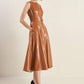 Camel faux leather midi dress by Flying Tomato, featuring a fitted silhouette and stylish design, displayed on a hanger.