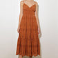 Brown Luminous Bliss woven eyelet midi dress by Flying Tomato, featuring intricate eyelet details and a flowing midi length.