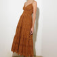 Brown Luminous Bliss woven eyelet midi dress by Flying Tomato, featuring intricate eyelet details and a flowing silhouette.