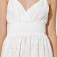 Off-white luminous bliss woven eyelet midi dress by Flying Tomato, featuring intricate eyelet details and a flowing silhouette.